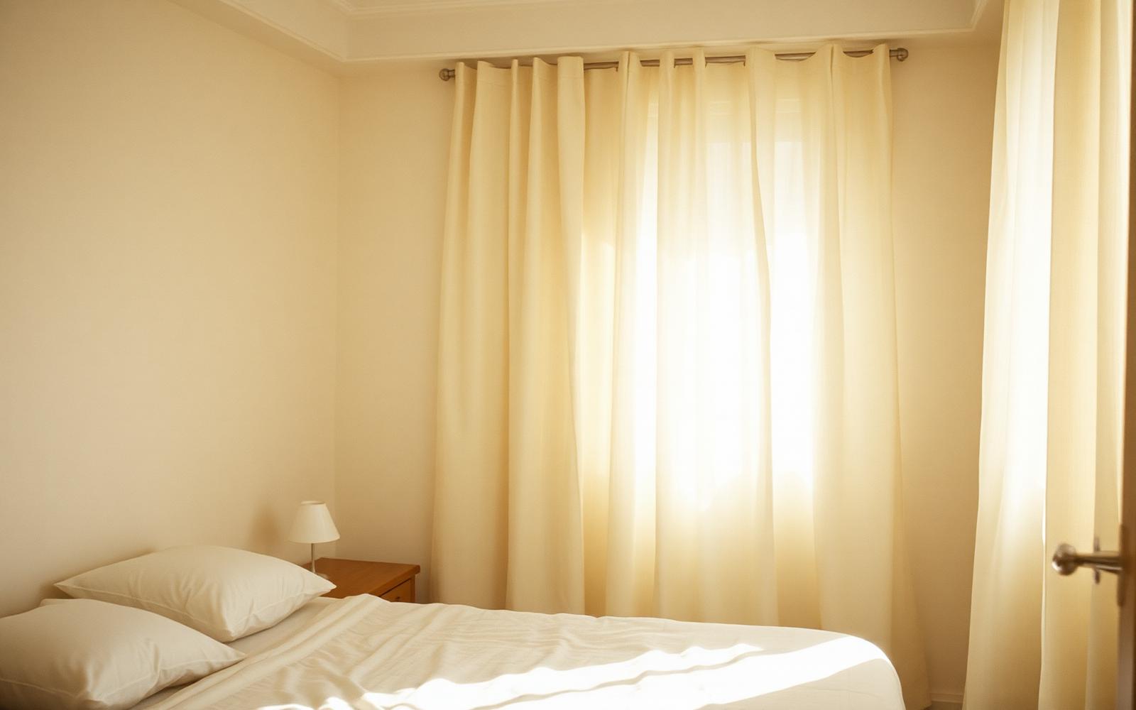 Soft morning light through linen curtains
